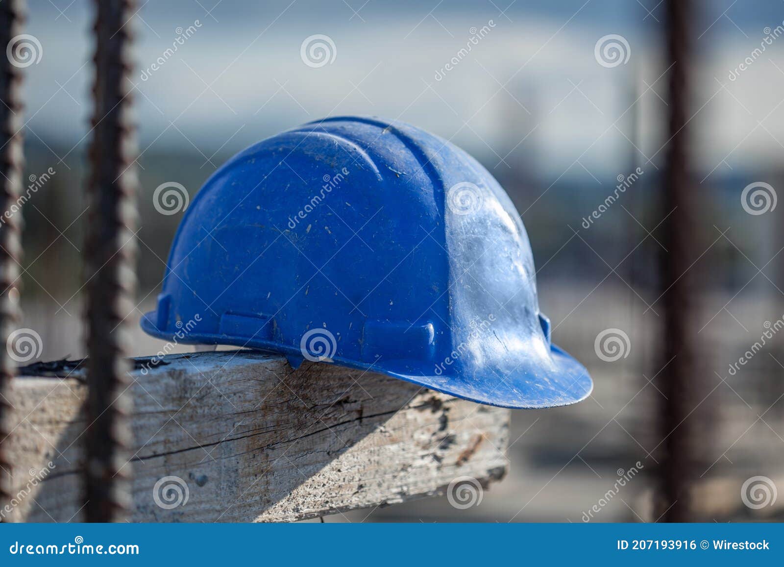 Blue Construction Safety Helmet at a Construction Site Stock Photo