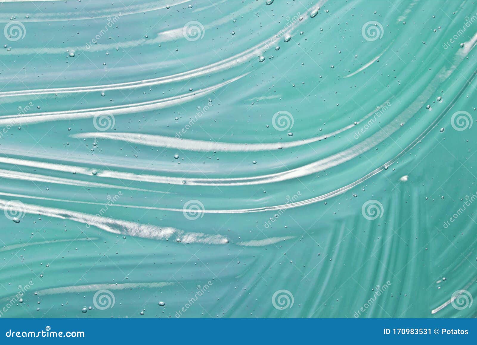 blue cosmetic gel texture background. transparent colored skin care, hair styling, hygiene product sample