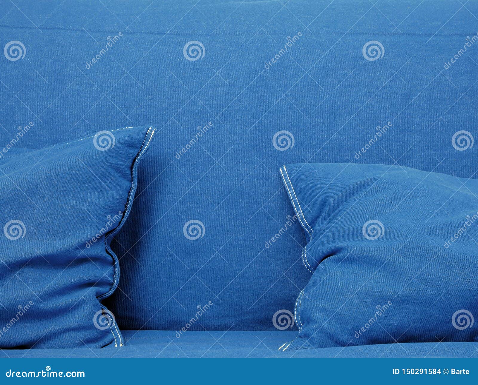 Blue couch with pillows stock photo. Image of close 150291584