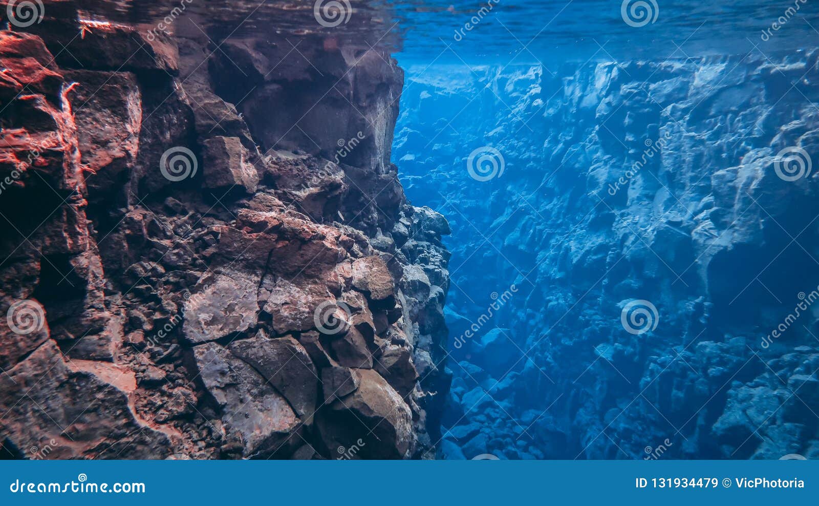 blue crystal clear glacial water in silfra thingvellir national park iceland