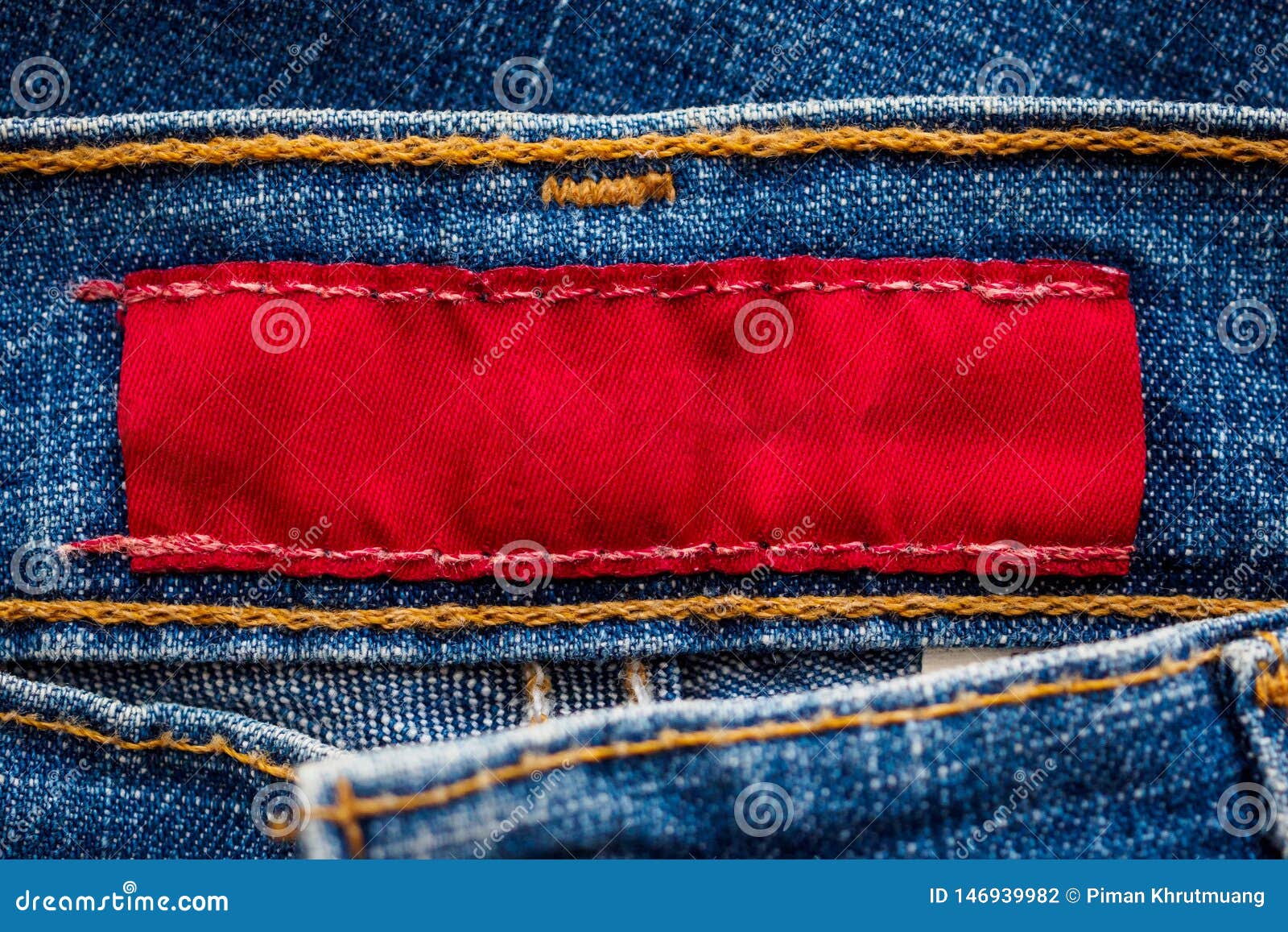 Blue Denim Jeans with Red Clothing Label Stock Photo - Image of closeup ...