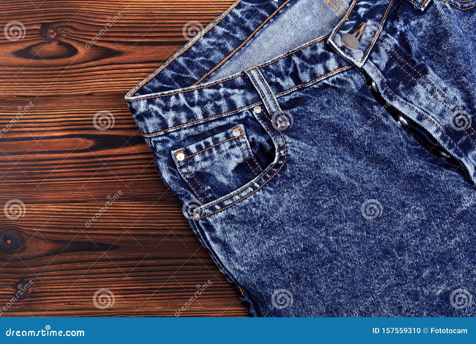 Blue Denim Jeans on Wooden Background Stock Photo - Image of closeup ...