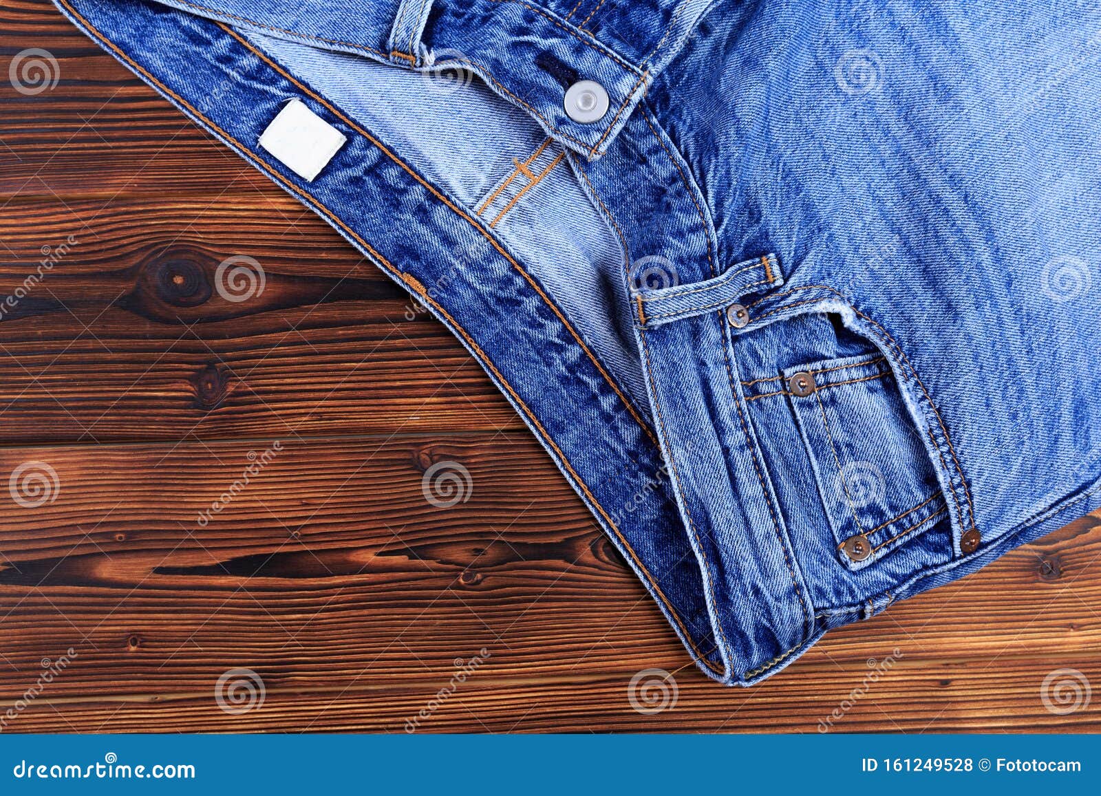 Blue Denim Jeans on Wooden Background Stock Photo - Image of fashion ...