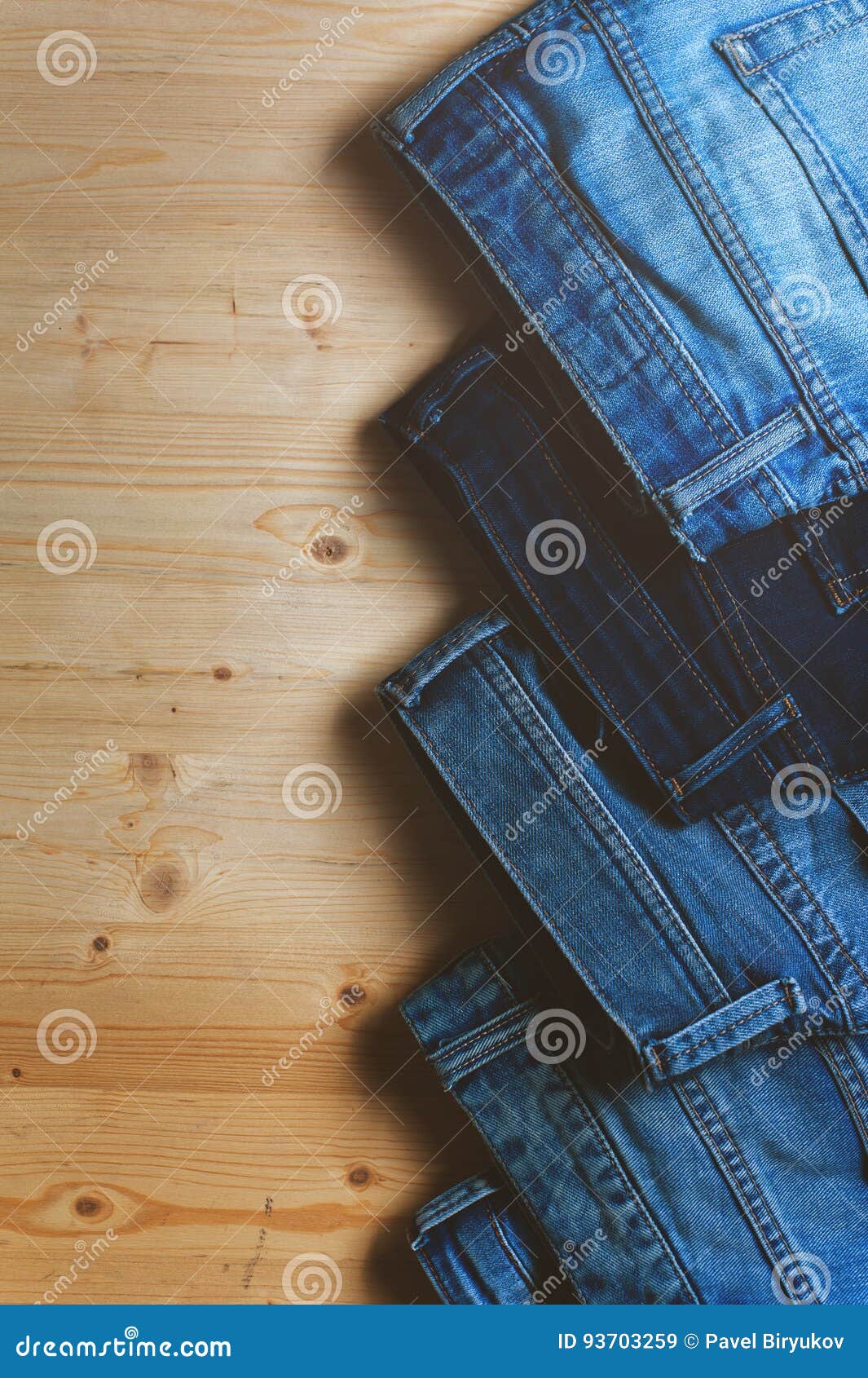 Blue Denim Jeans on Wooden Table. Stock Image - Image of denim, blue ...