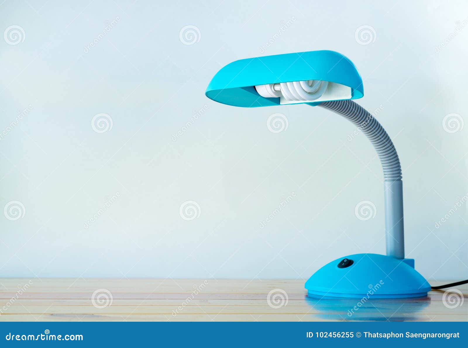 Blue Desk Lamp On Wooden Table With Copy Space Stock Image