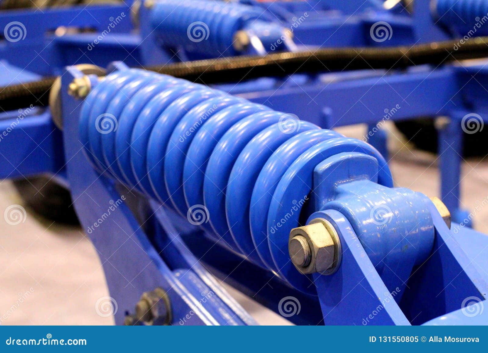 Blue Detail of the Spring Shock Absorber is a Mechanical Transport
