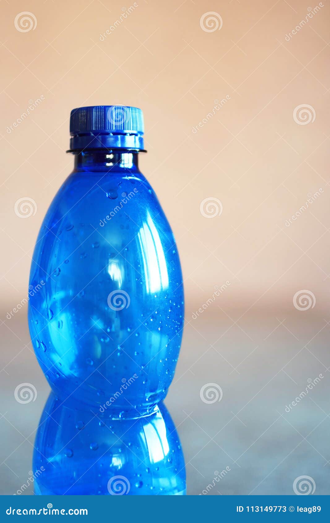 Blue Empty Plastic Bottle with Cork and Water Drops Stock Image Image