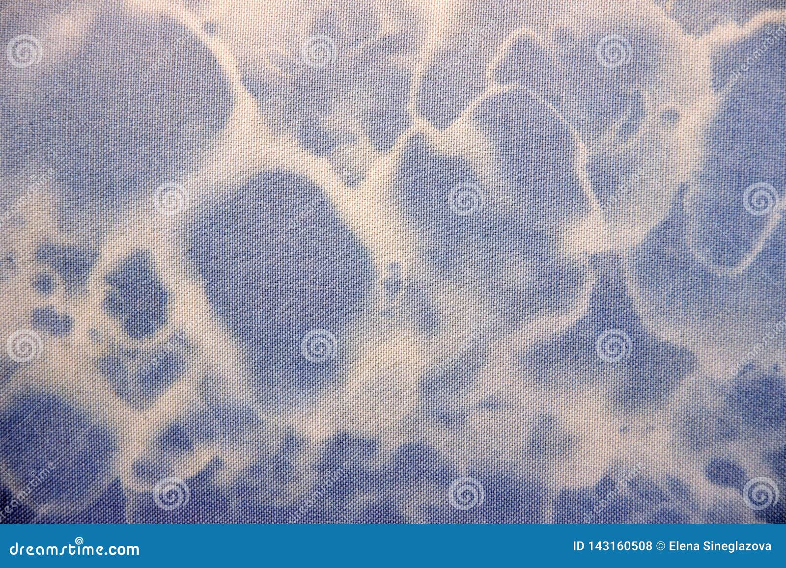 blue fabric textur with white circles.