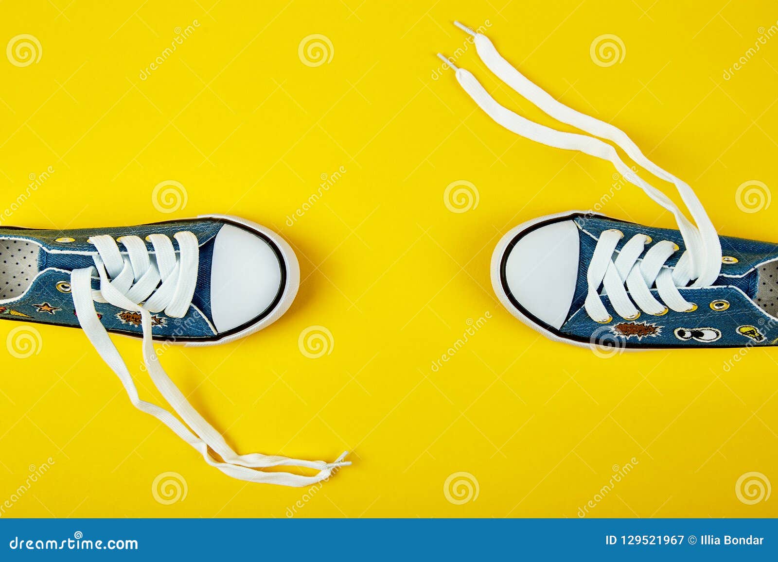 Blue Female Or Male Sneakers On Yellow Paper Background. Stock Image ...