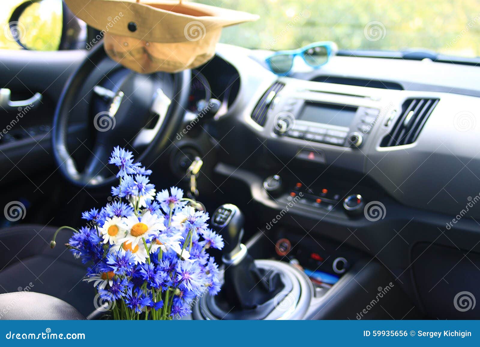 Blue flowers in the car stock photo. Image of freshener 59935656