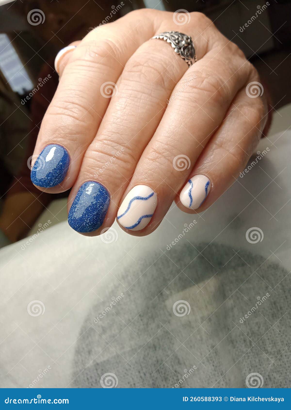 Blue gel nail polish stock image. Image of manicure 260588393