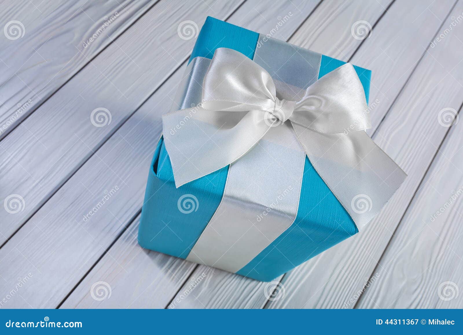 Blue Gift Box with White Bow on White Wooden Table Stock Image Image