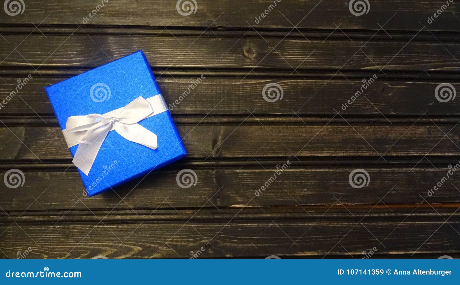 Blue Glitter Gift Box With A White Bow. Stock Image