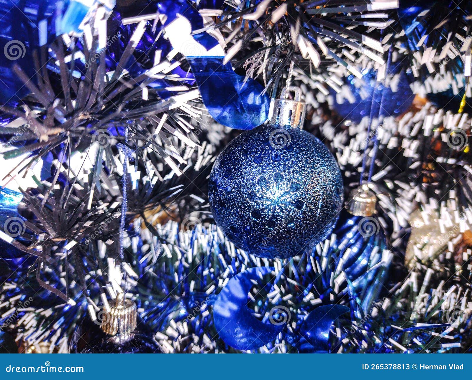 Blue Globe and Other Decorations on a Christmas Tree Stock Image