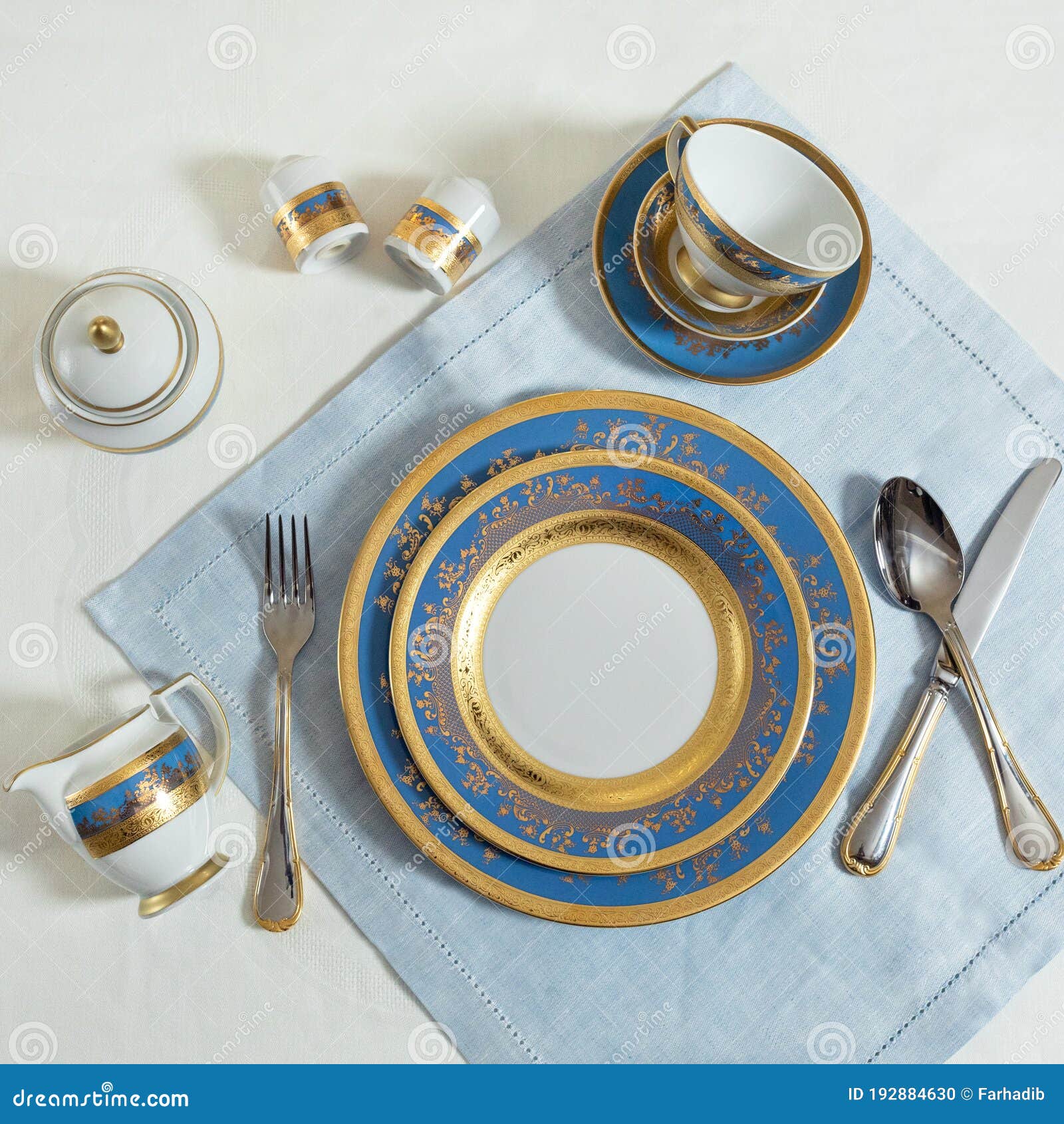 Blue Gold Tableware, Dishes, Plates, Utensils on the Table Stock Photo