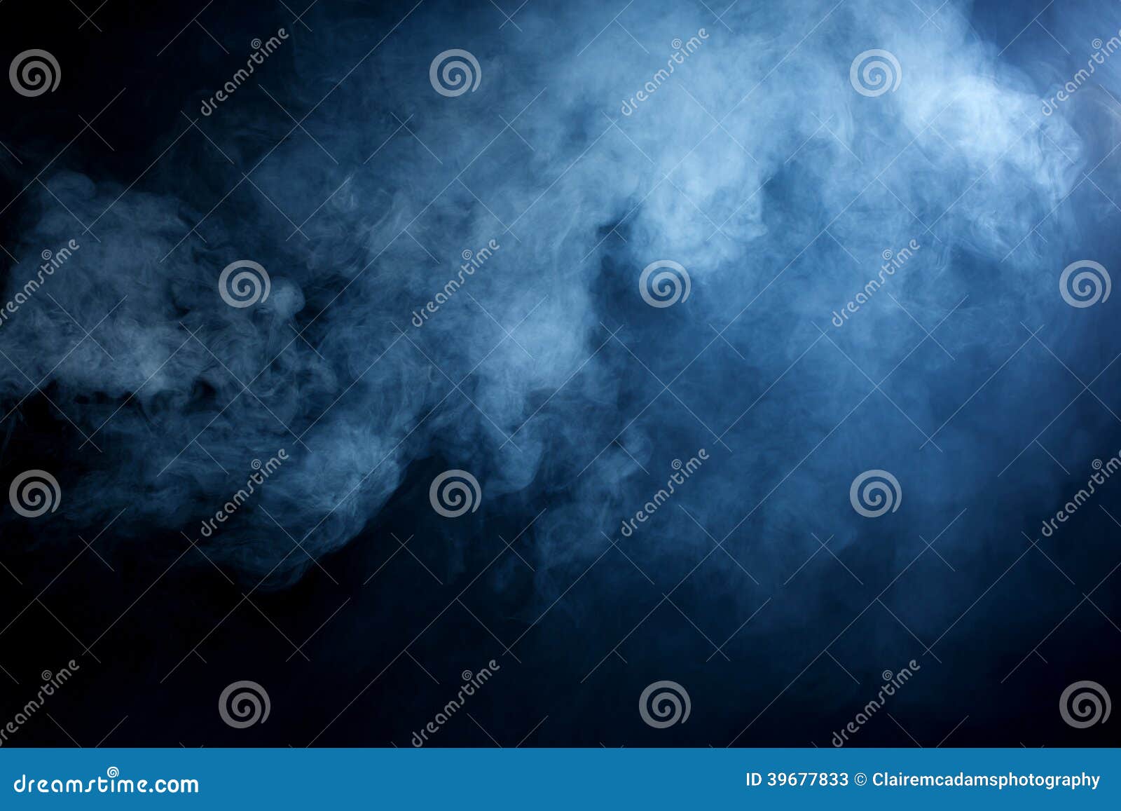blue/grey smoke on black background