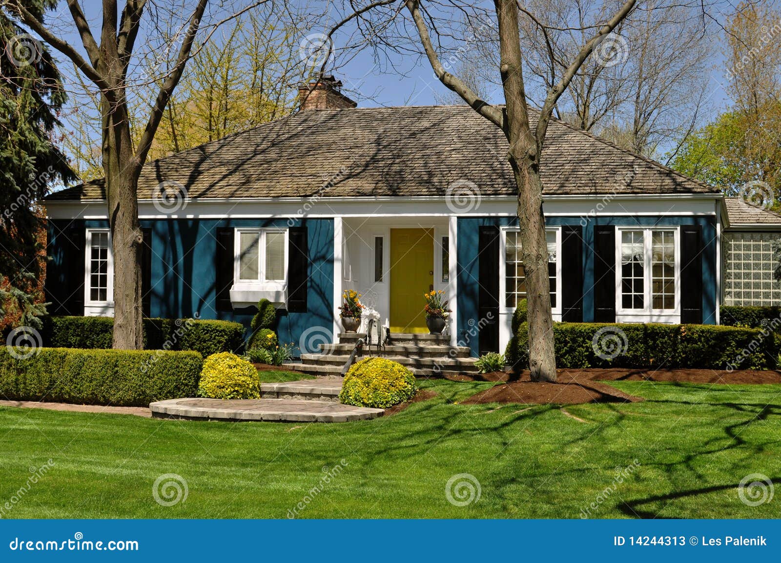 Blue House With Nice Landscaping Stock Image - Image: 14244313