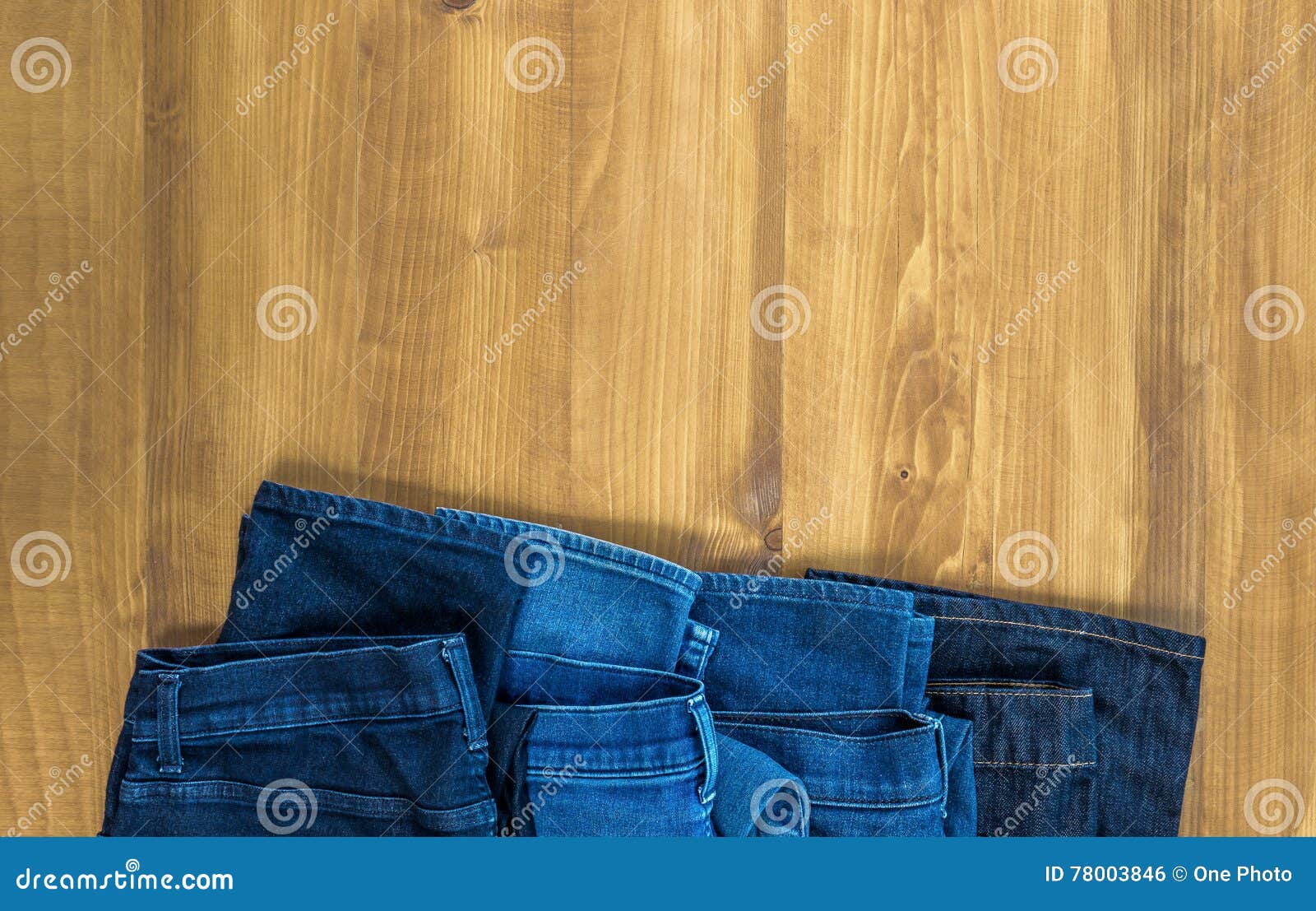 Blue Jeans on a Brown Wooden Background and Blue Jeans Denim Col Stock ...