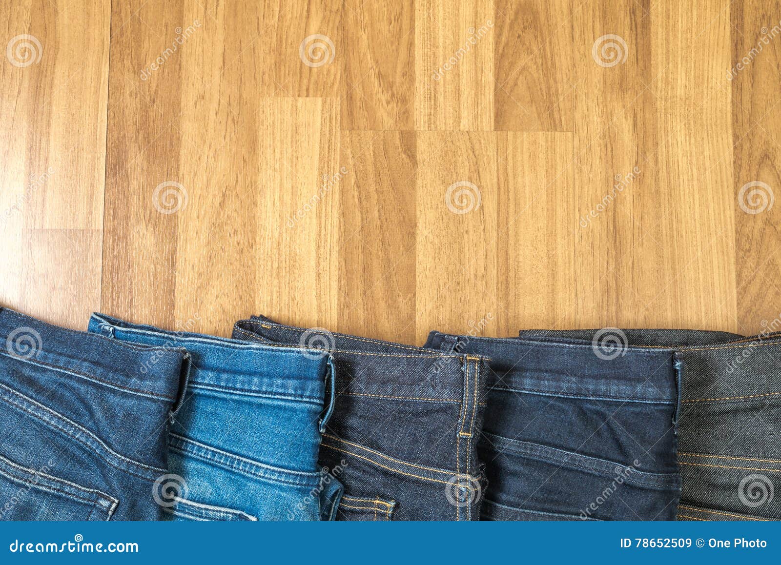 Blue Jeans on a Brown Wooden Background and Blue Jeans Denim Col Stock ...