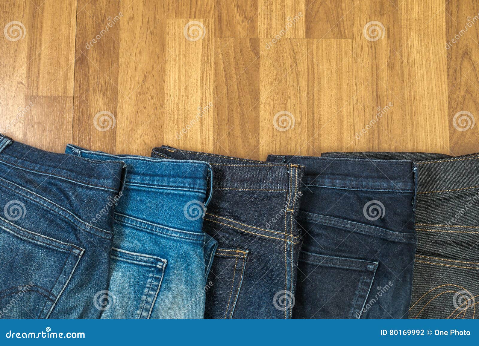 Blue Jeans on a Brown Wooden Background and Blue Jeans Denim Col Stock ...