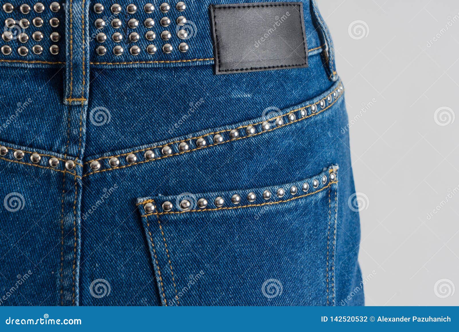 Blue Jeans Skirt Decorated with Metallic Rivets. Stock Photo Image of