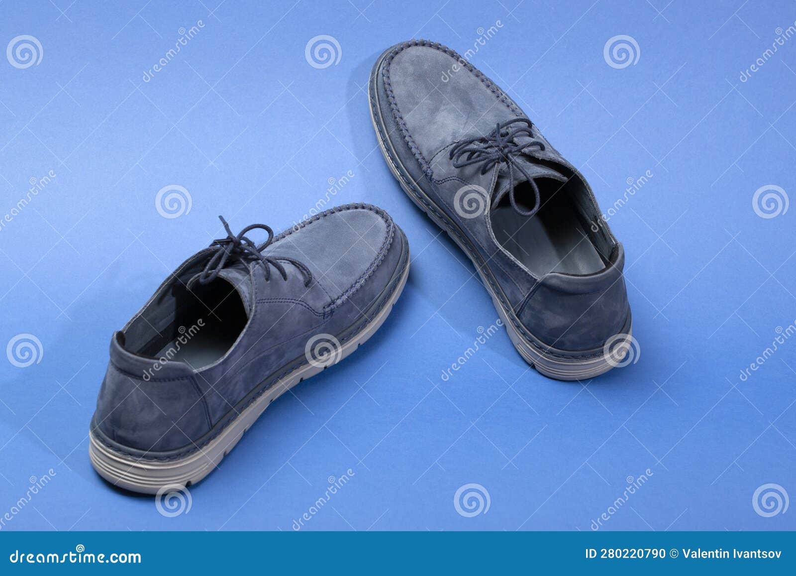 Blue Leather Men S Shoes on a Blue Background Stock Photo - Image of ...