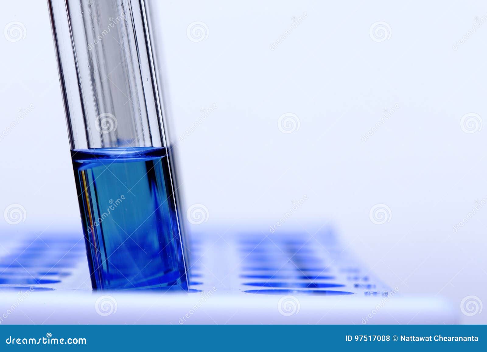 Blue Liquid in Glass Tube Lab Test Tools on Plastic Stand Holder Stock