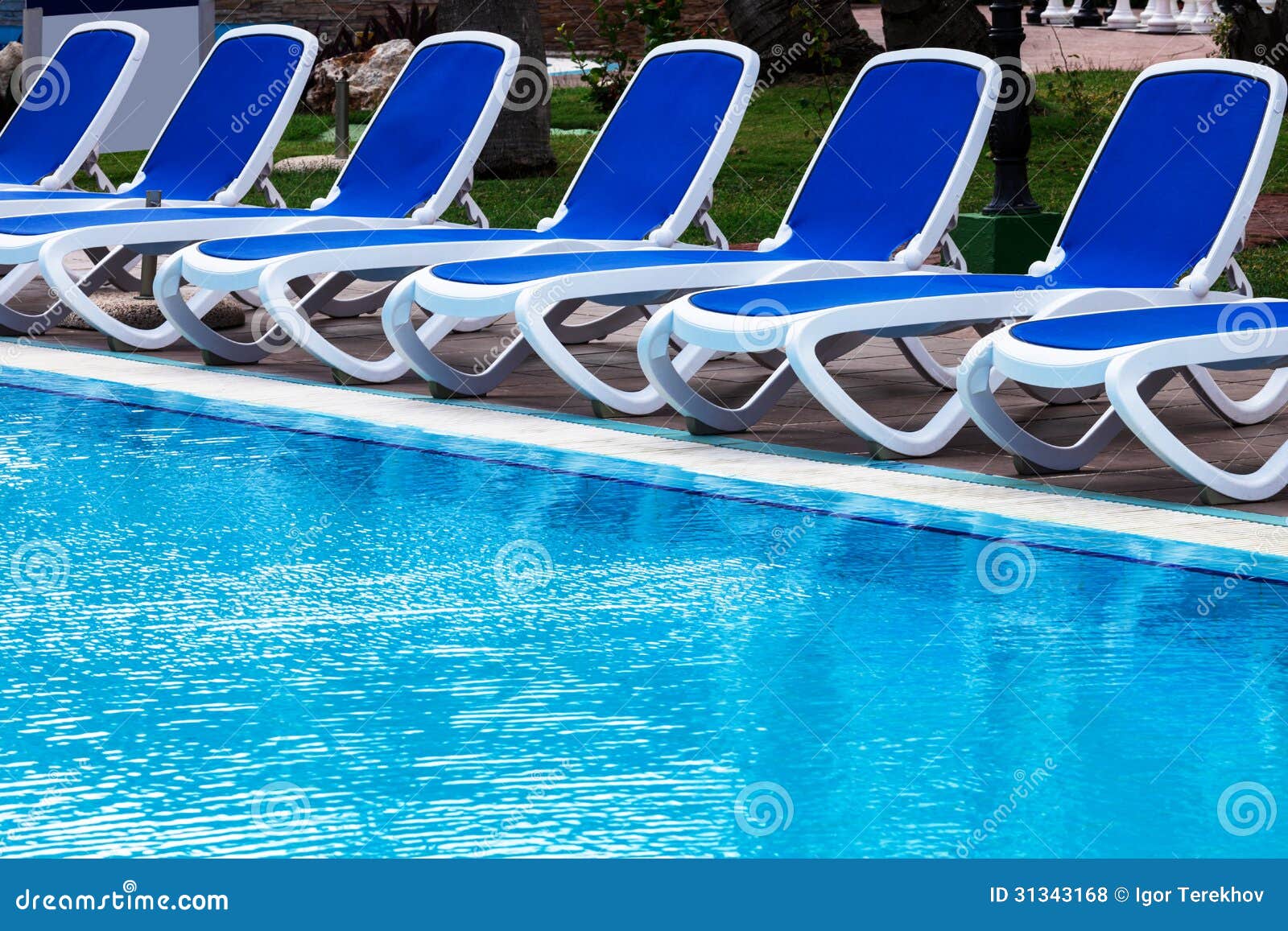 Blue lounge chairs stock photo. Image of chaise, floor - 31343168