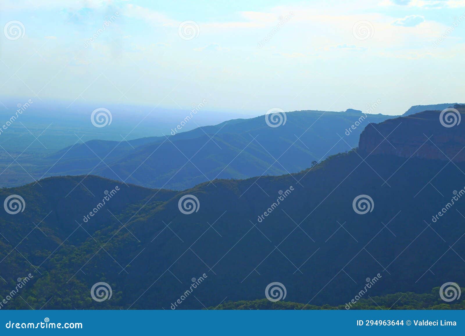 blue mountains with color scale on foggy day
