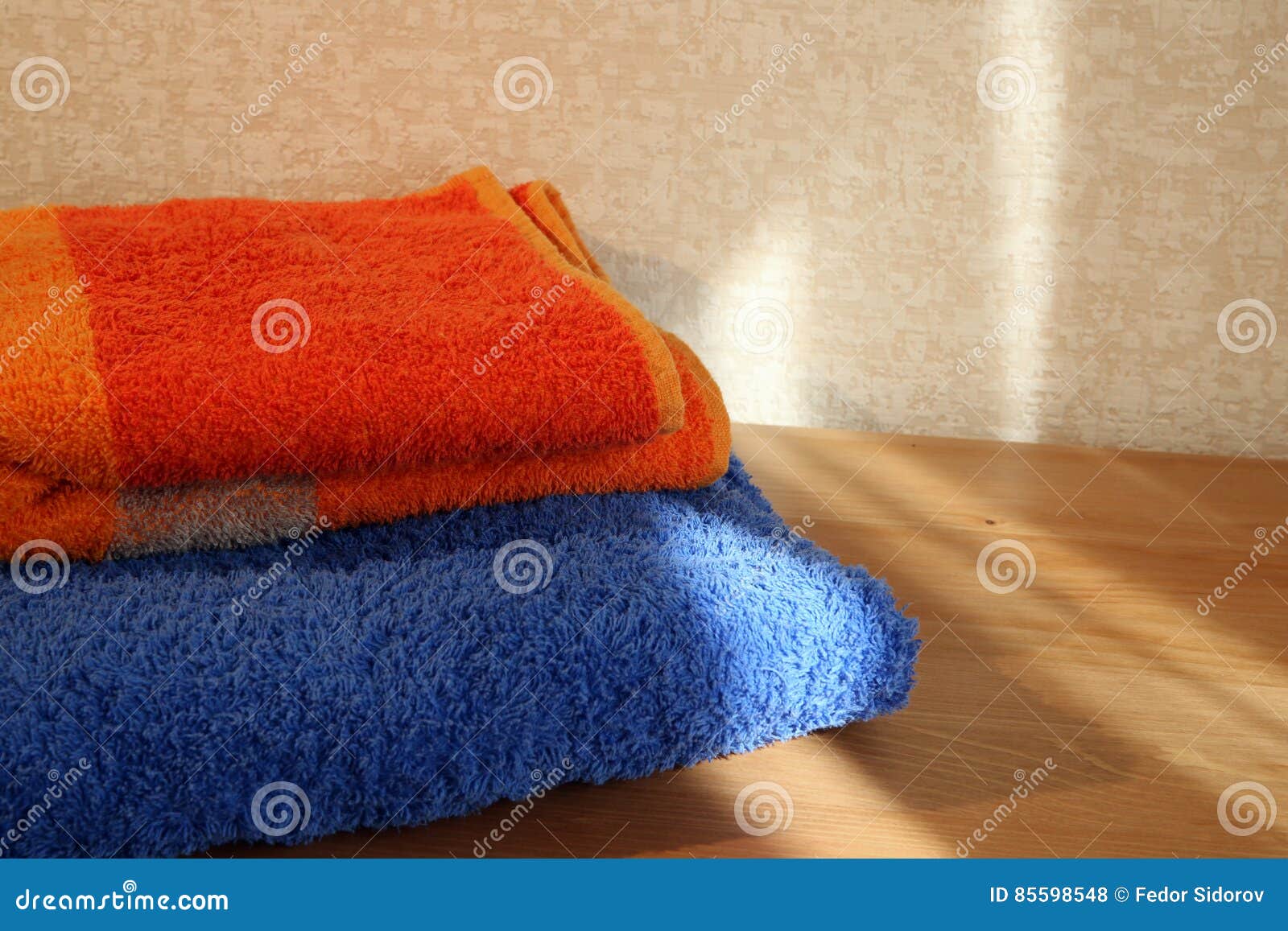 Blue and orange towels stock photo. Image of domestic 85598548