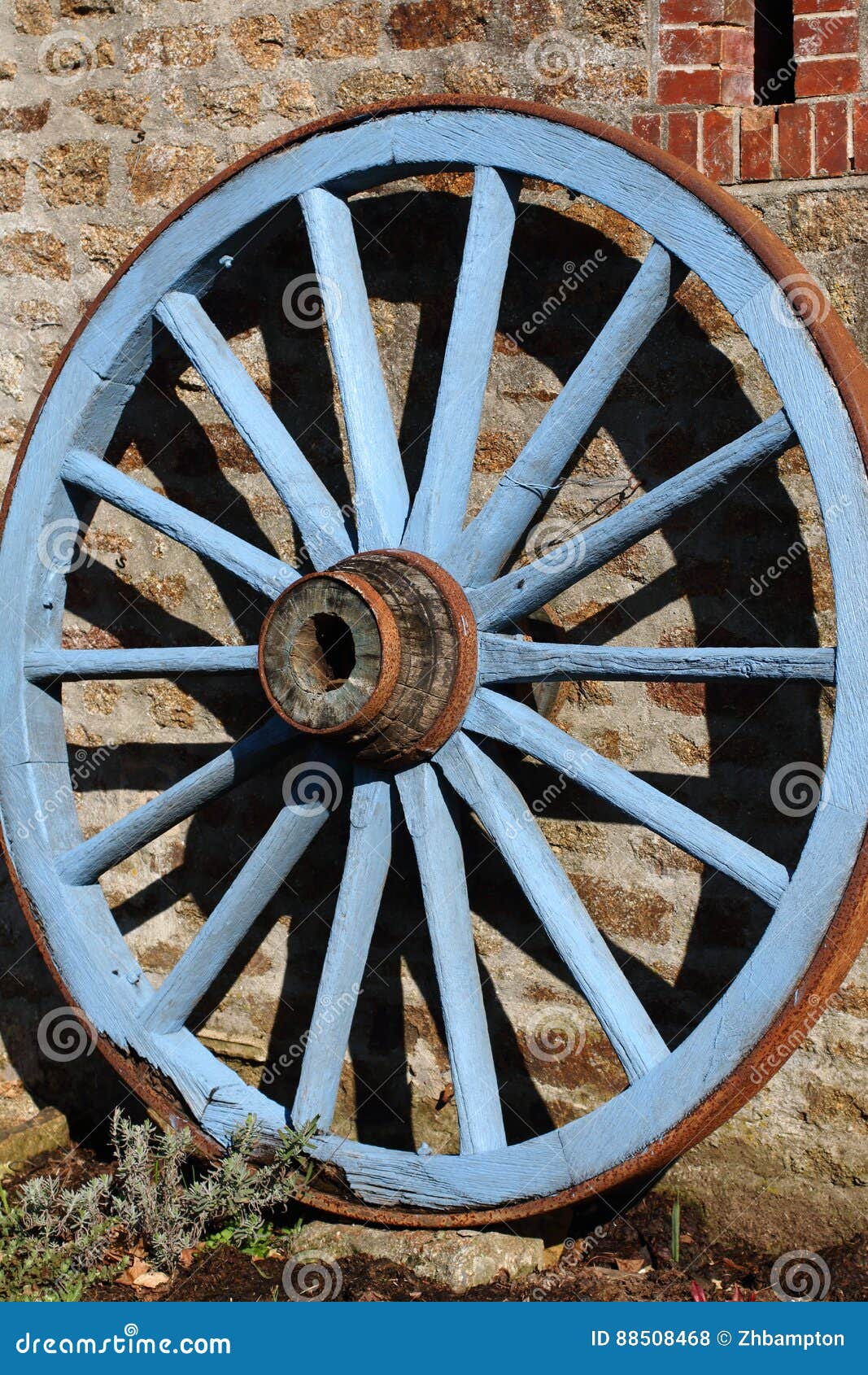 Blue painted wagon wheel stock photo. Image of brown 88508468