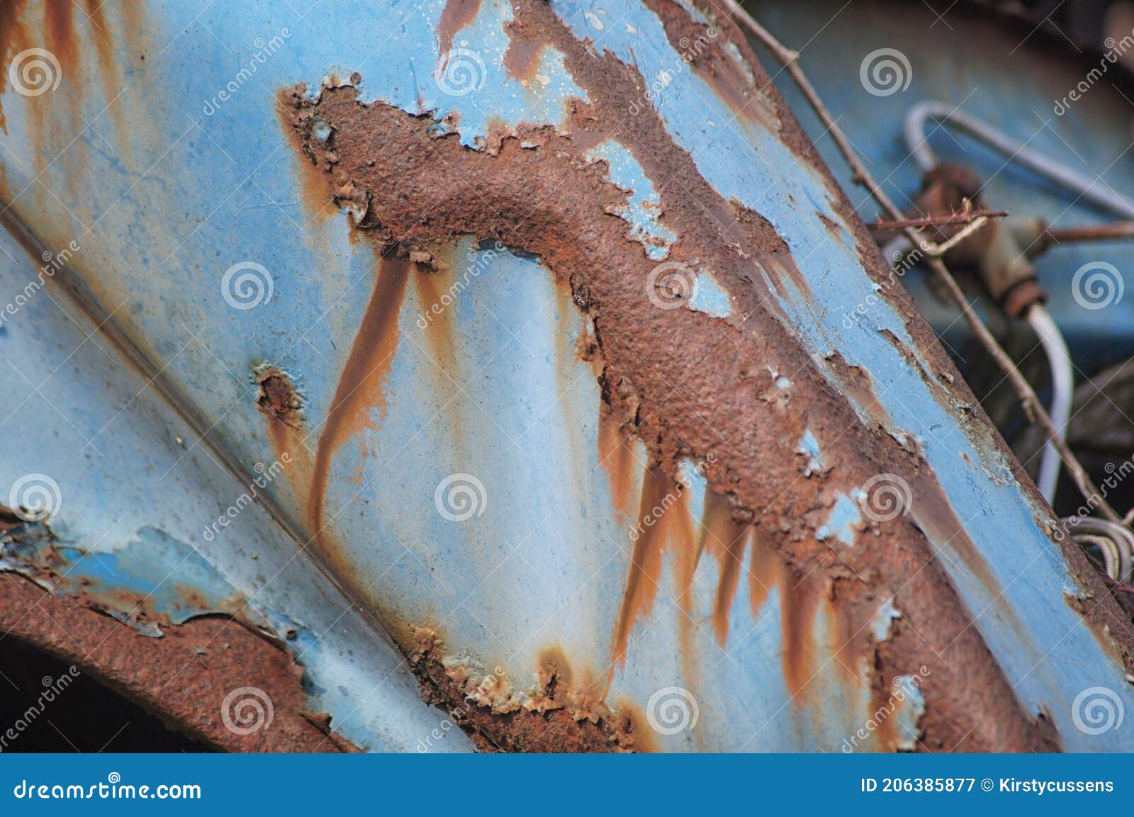 Blue Paintwork and Rust on a Neglacted Car in a Scrap Yard Stock Image
