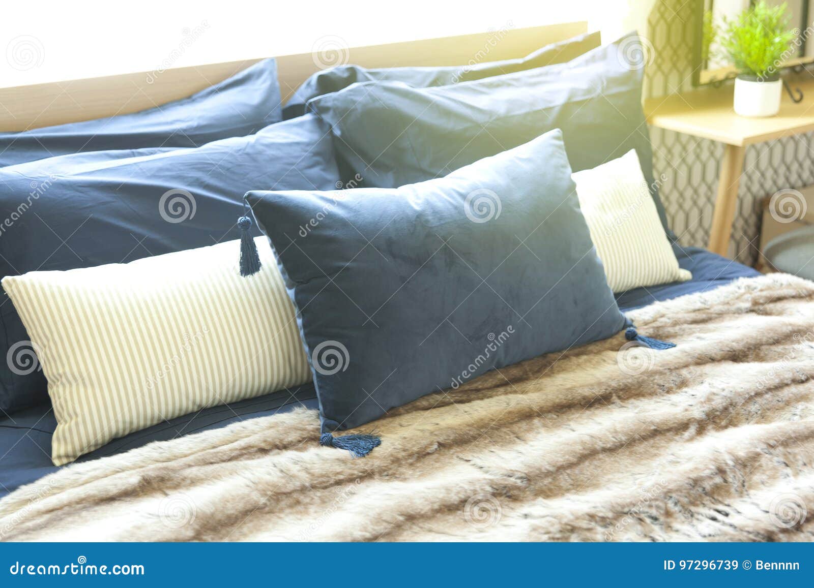 Blue pillow on bed stock image. Image of comfort, light 97296739
