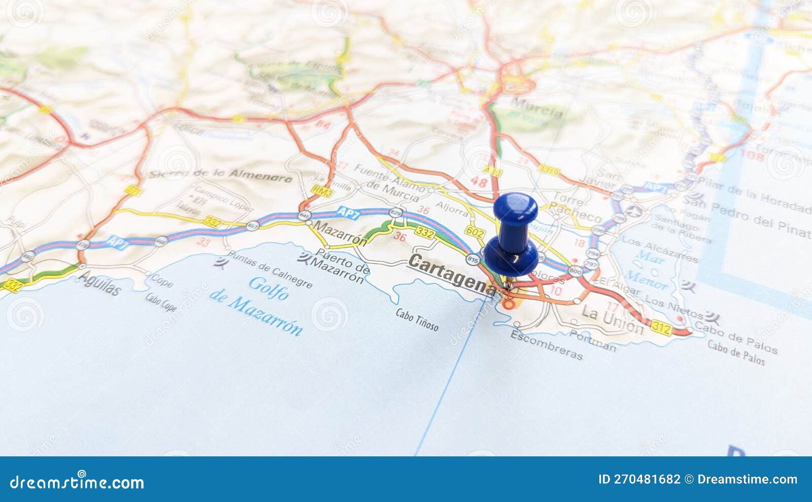 a blue pin stuck in cartagena on a map of spain