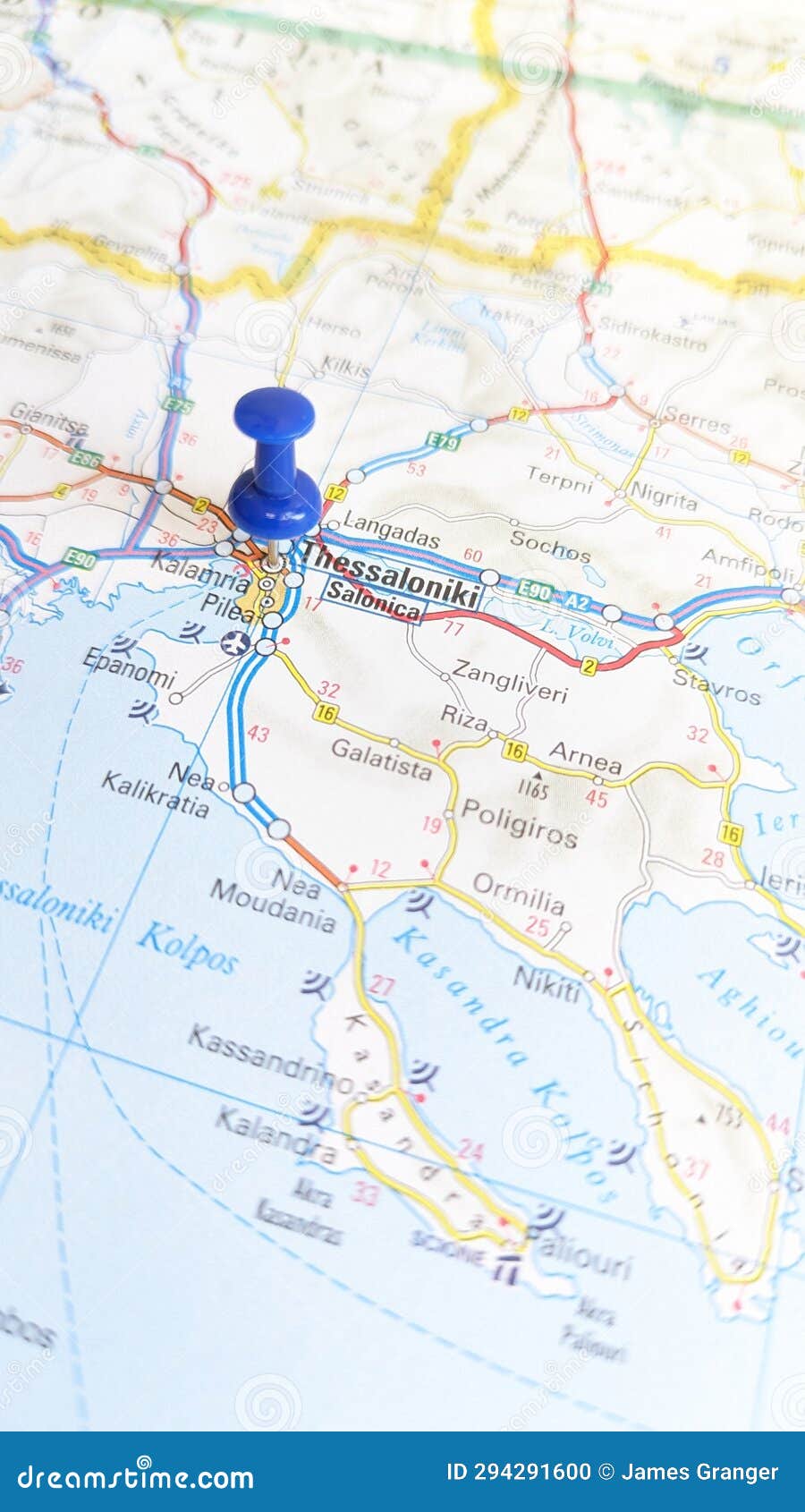 a blue pin stuck in thessaloniki on a map of greece portrait