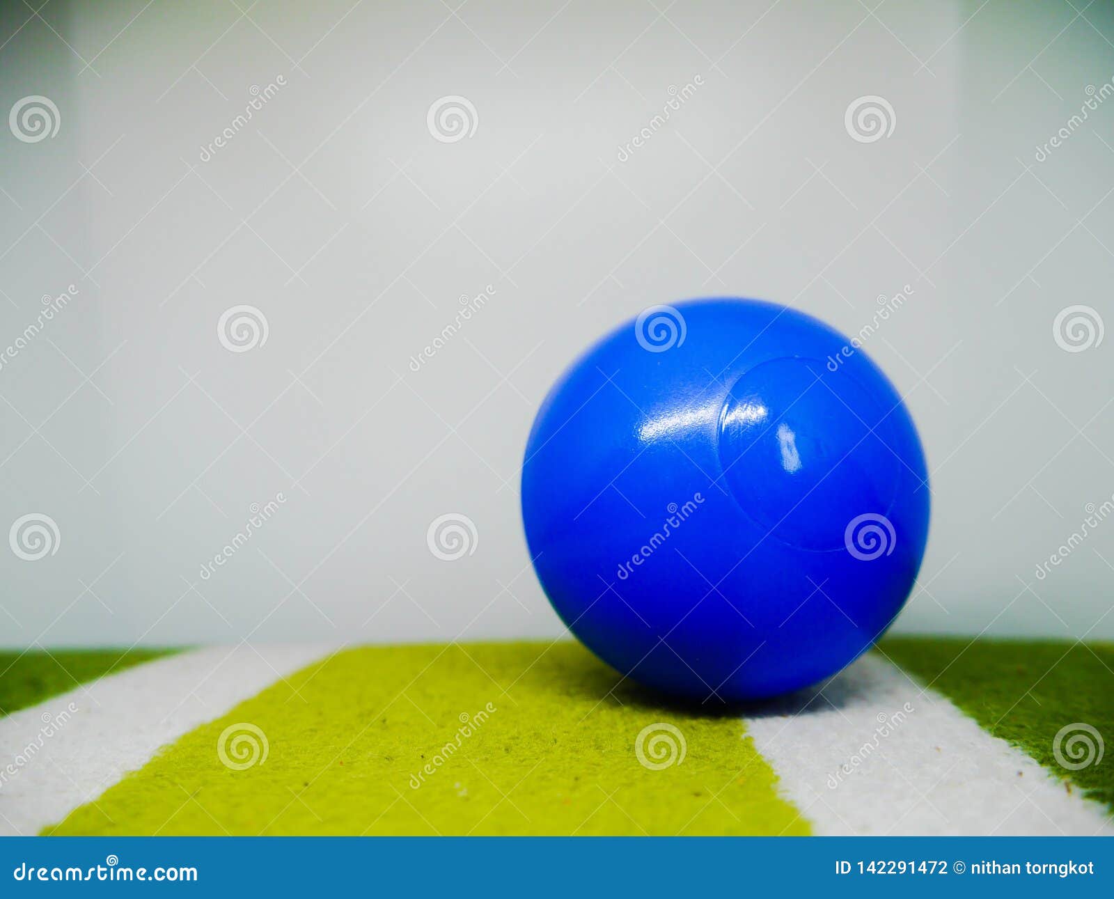 Blue plastic ball isolated stock photo. Image of ball 142291472