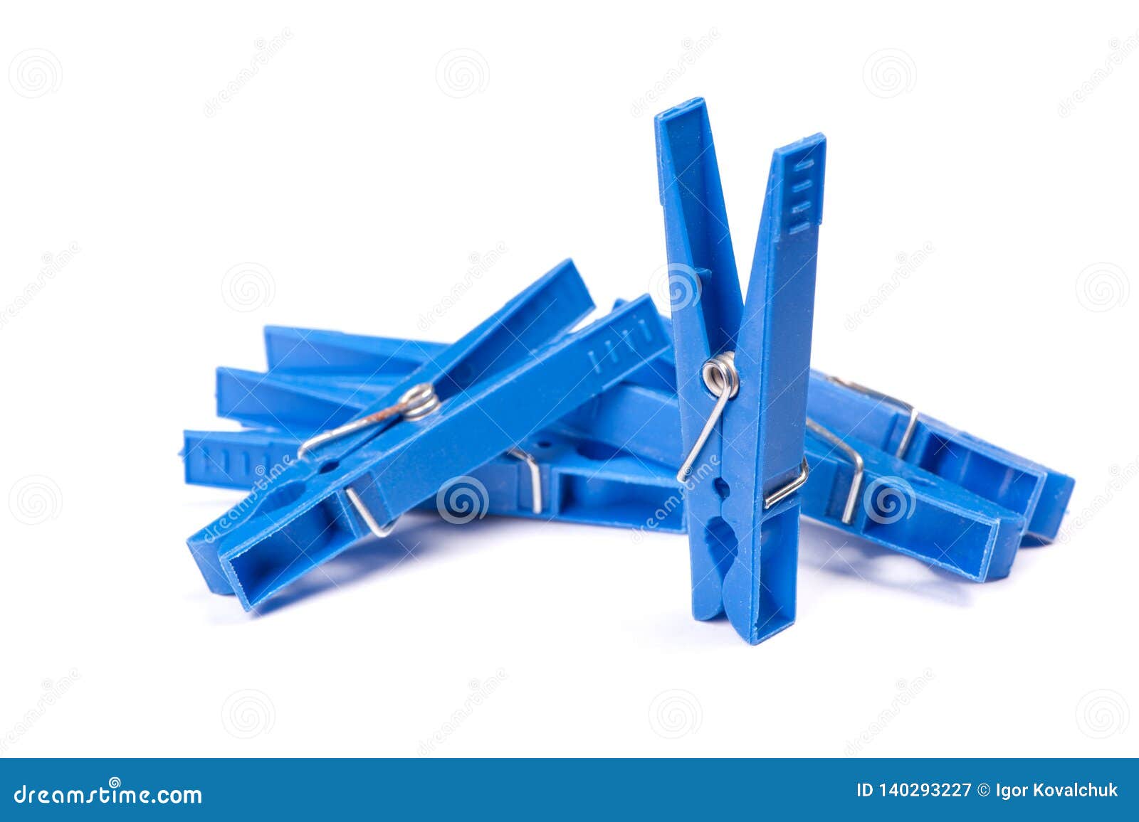 Blue plastic clothespins stock image. Image of closeup 140293227