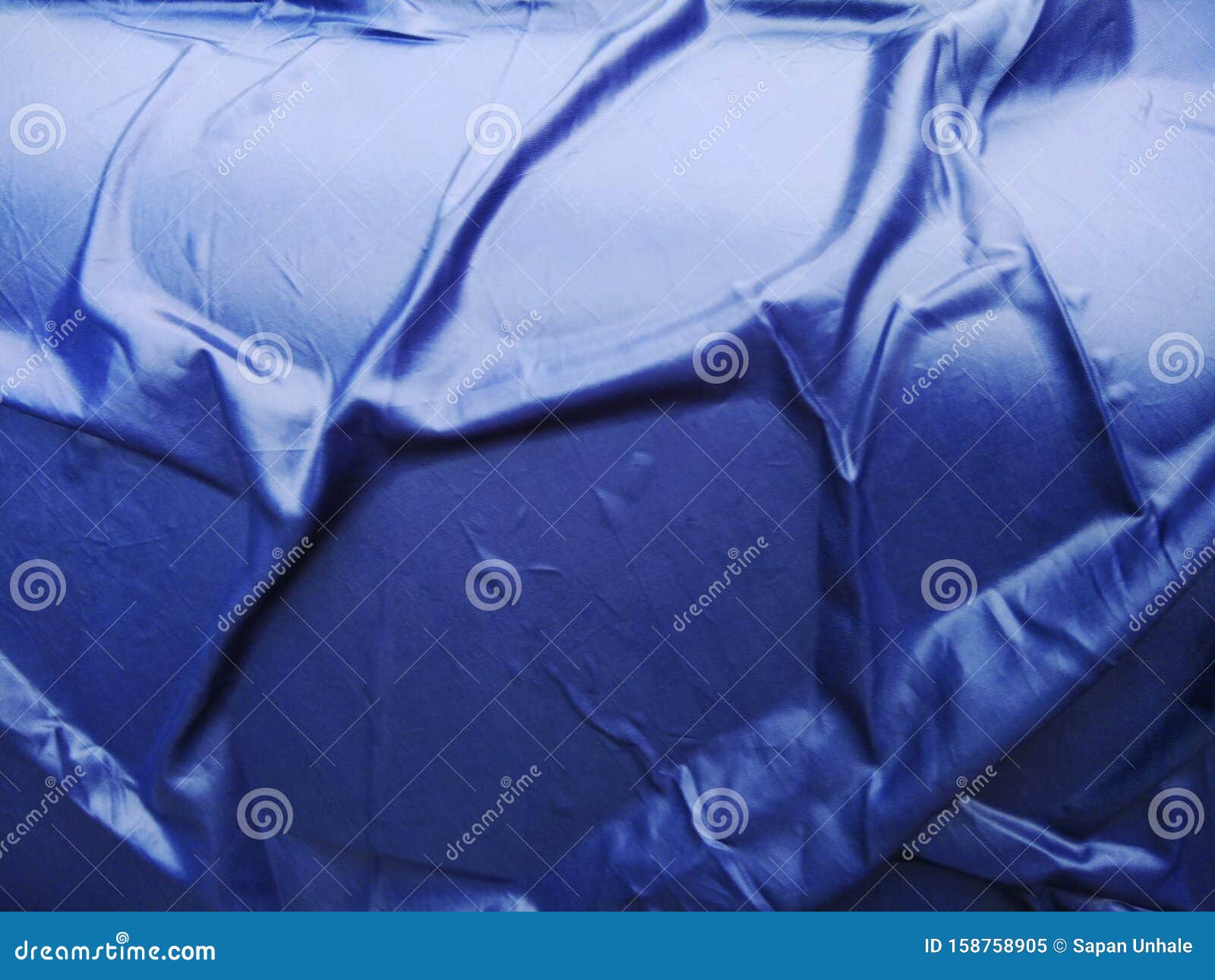 The Blue Plastic Sheet on the Car for Dust and Rain Protection. Stock