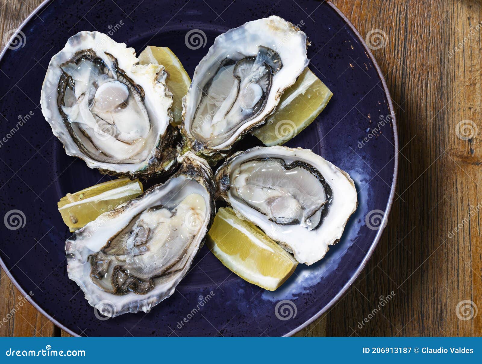 Blue Plate with Four Open Oysters and Lemon Stock Image Image of