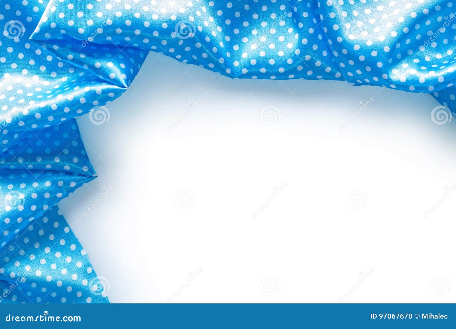 Blue Polkadot Folded Tablecloth on White Background Stock Photo