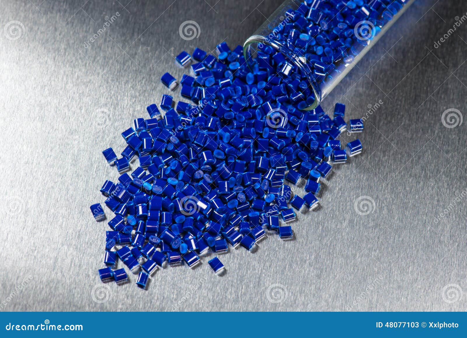 blue polymer granules in test glass
