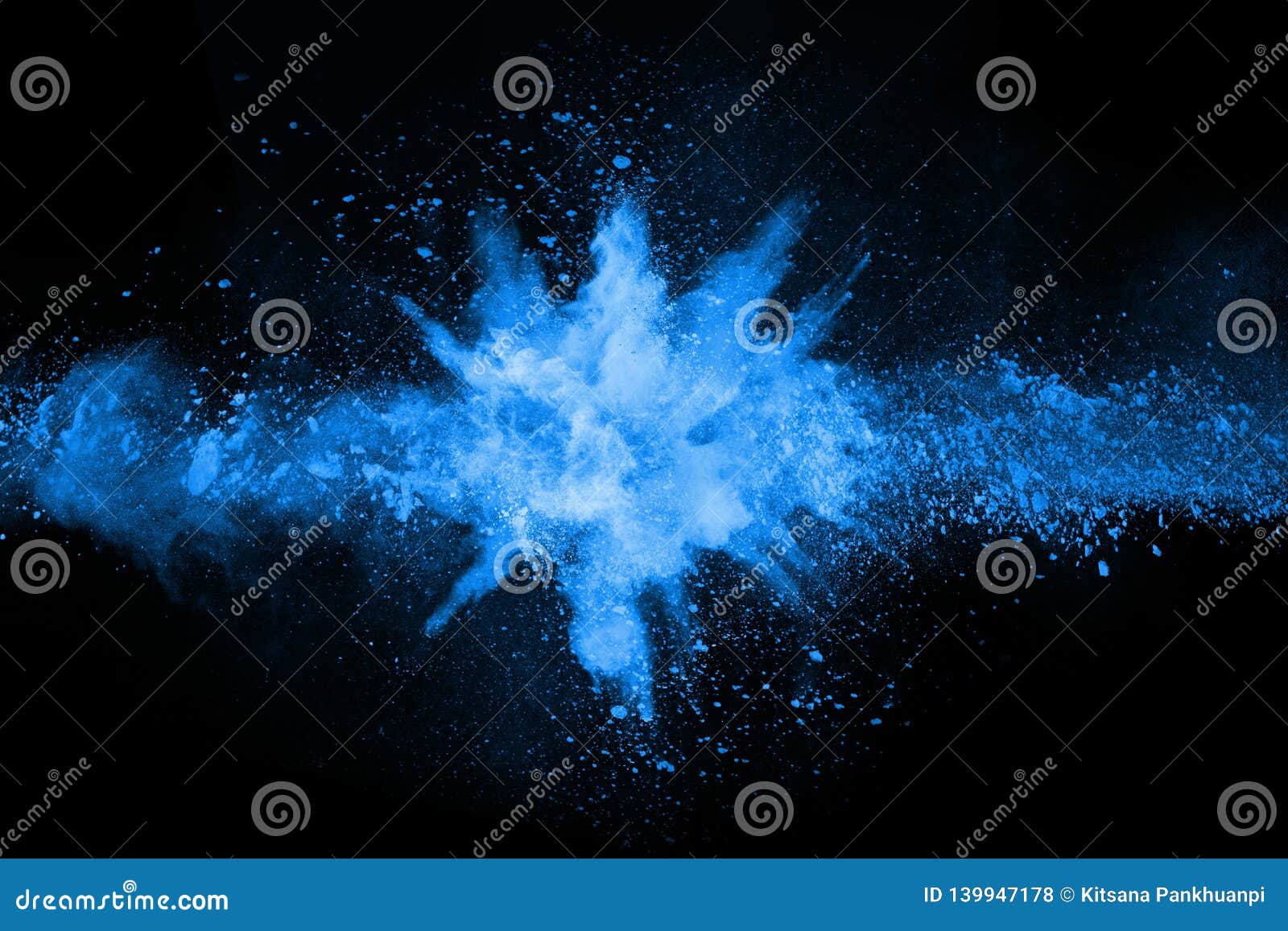 blue powder explosion on black background.