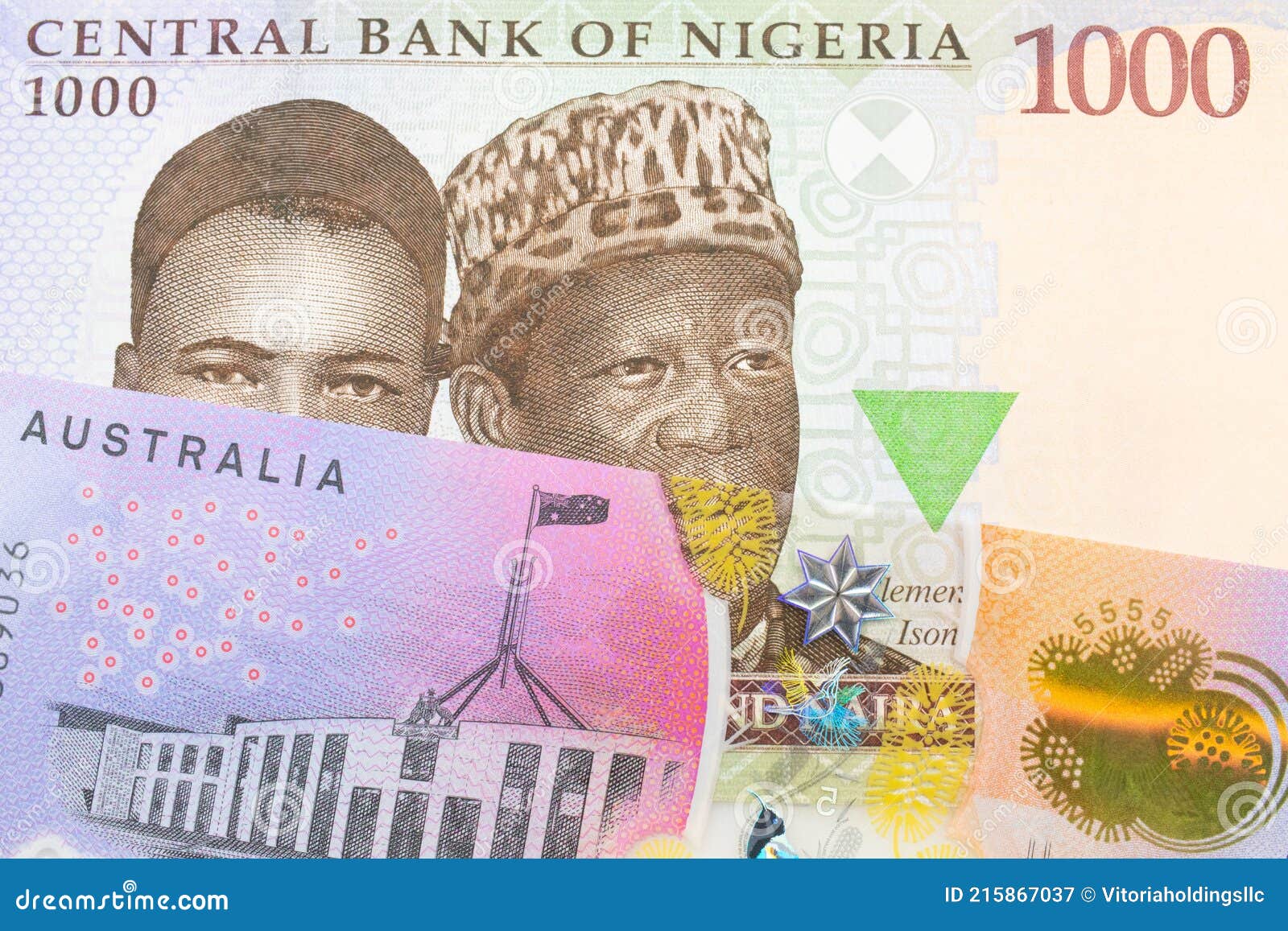 A Blue, Purple and Green One Thousand Note from Nigeria Paired with a Colorful Five Dollar Bill from Australia. Stock Image - Image of canberra, australian: 215867037