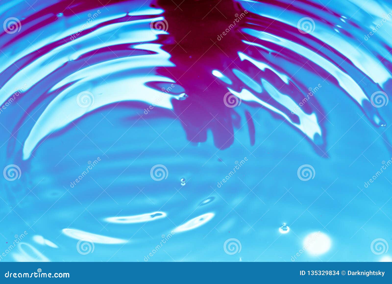 blue and purple red water showing circular waves