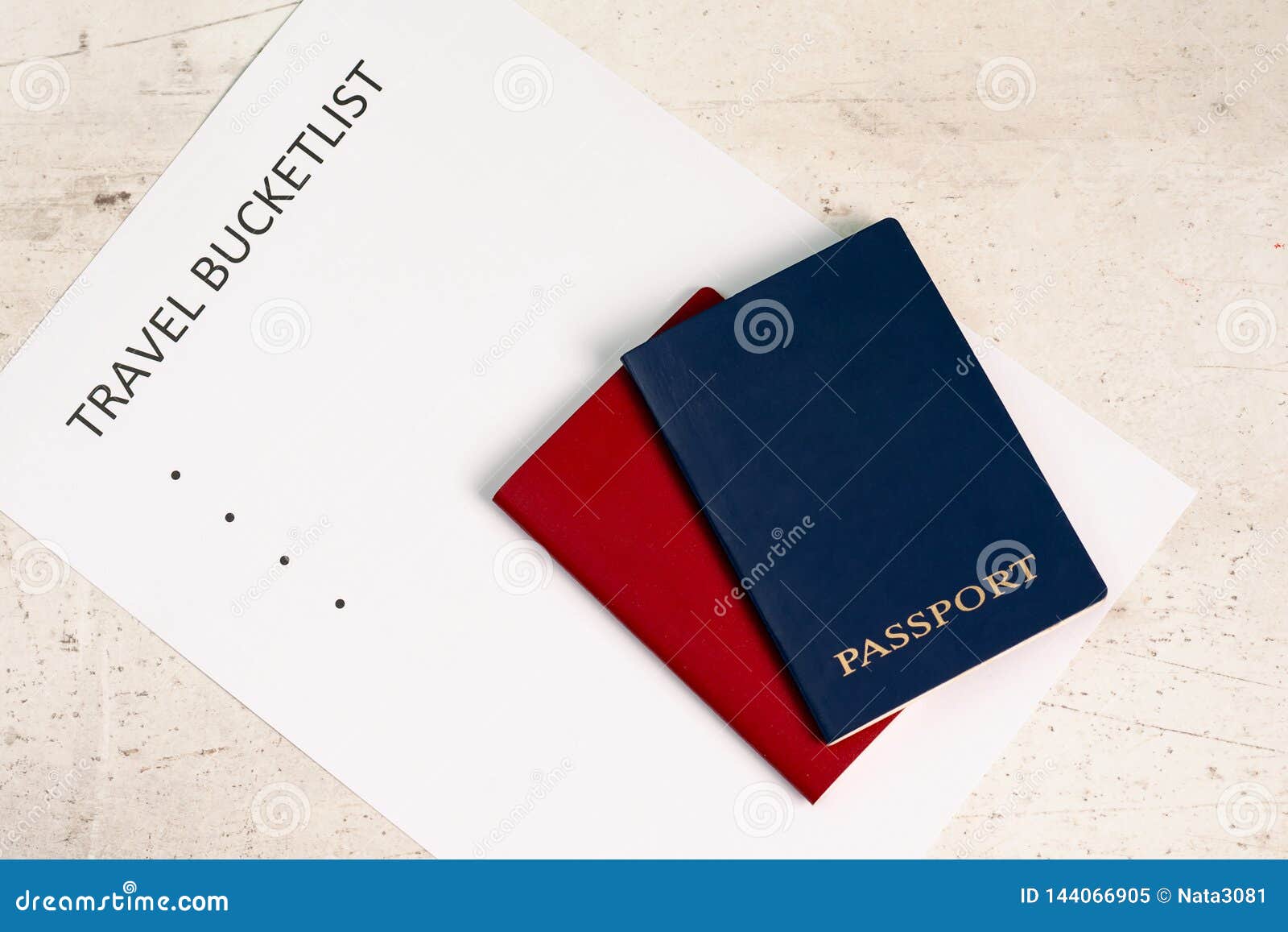 blue and red travel passports on a light background, next to the inscription travel bucketlist.