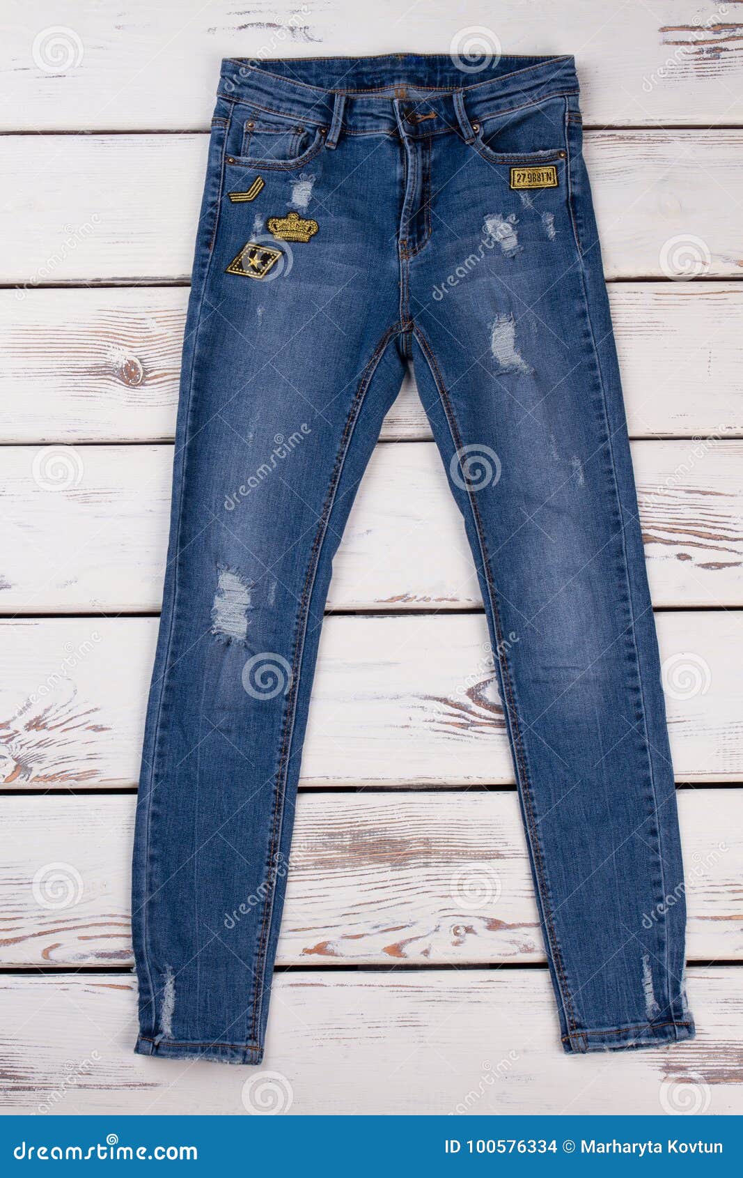 Blue Ripped Jeans with Patches Stock Photo - Image of apparel, autumn ...