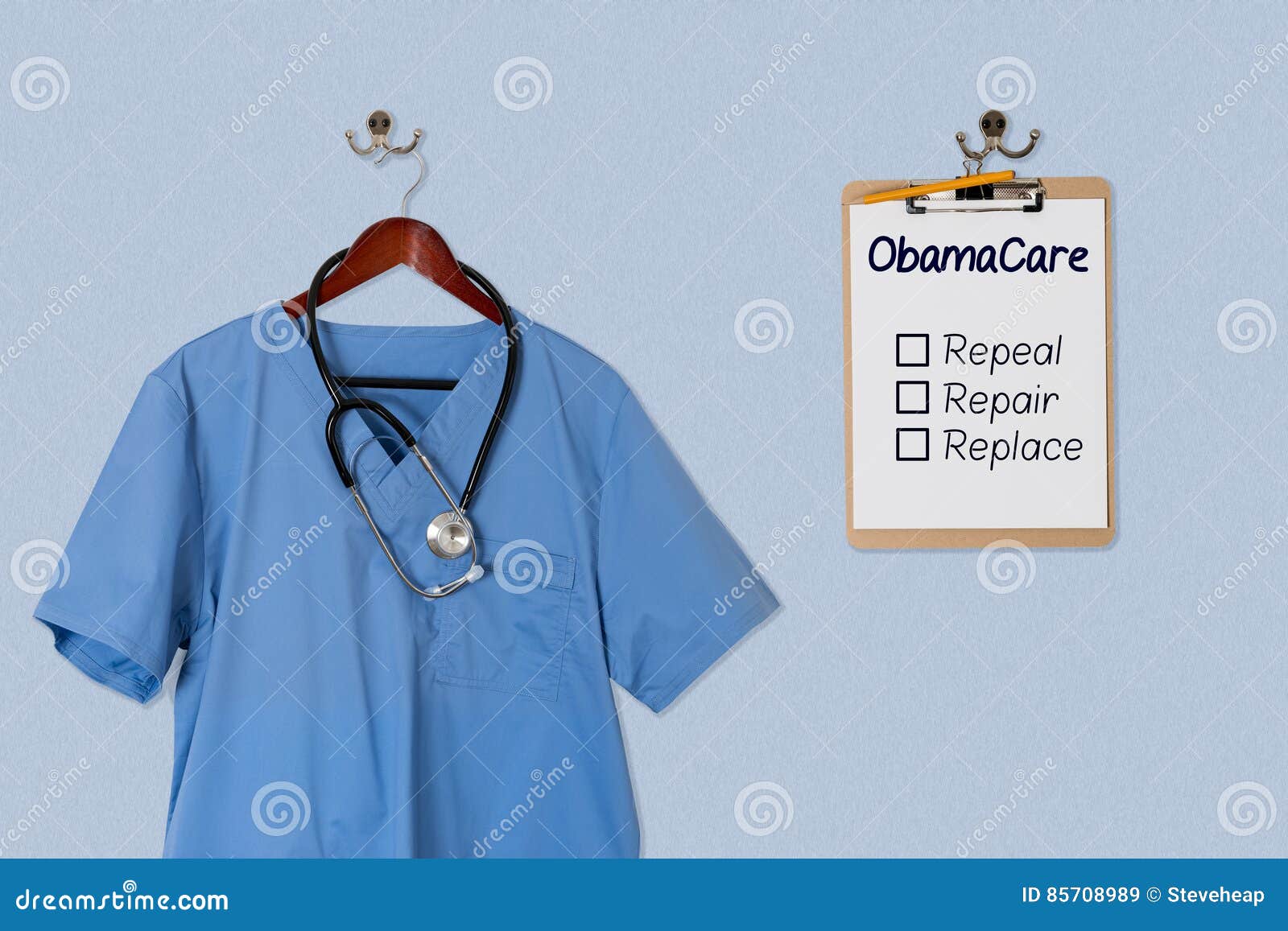 Blue Scrubs Shirt for Medical Professional Hanging with Clipboar Stock ...