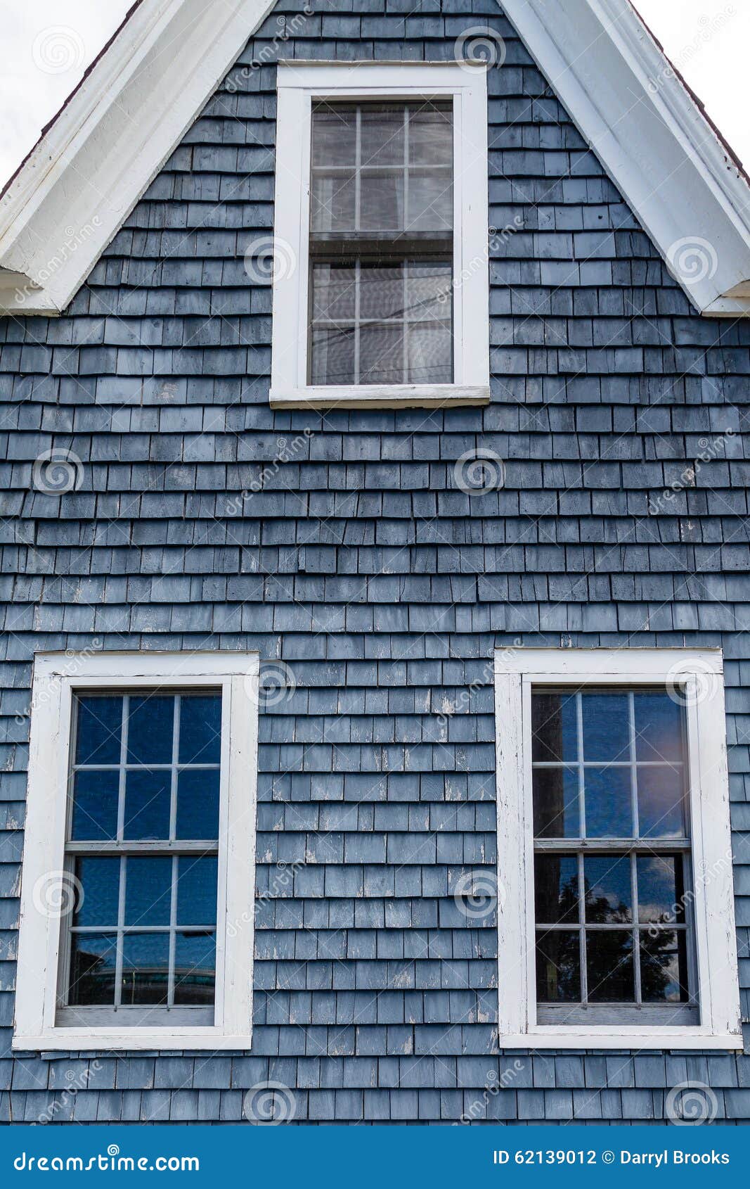 Blue Clapboard Siding House With Grass Filled Front Yard. RoyaltyFree