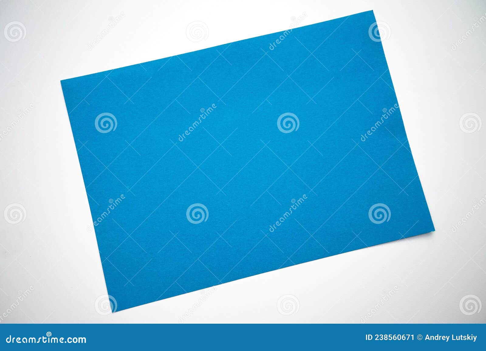 A Blue Sheet of Paper on a White Isolate.a Clean Place for Text Stock
