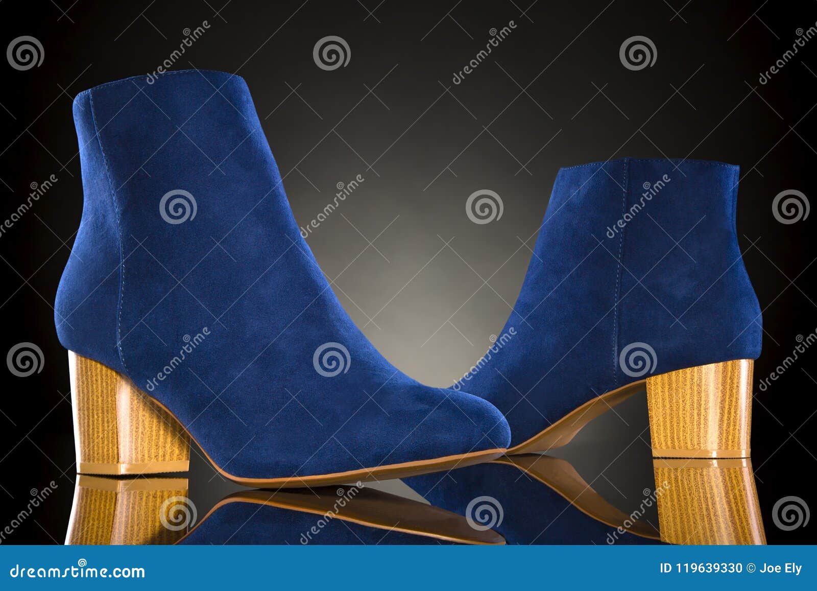 Blue Shoes on a Black Background with Reflection Stock Photo Image of